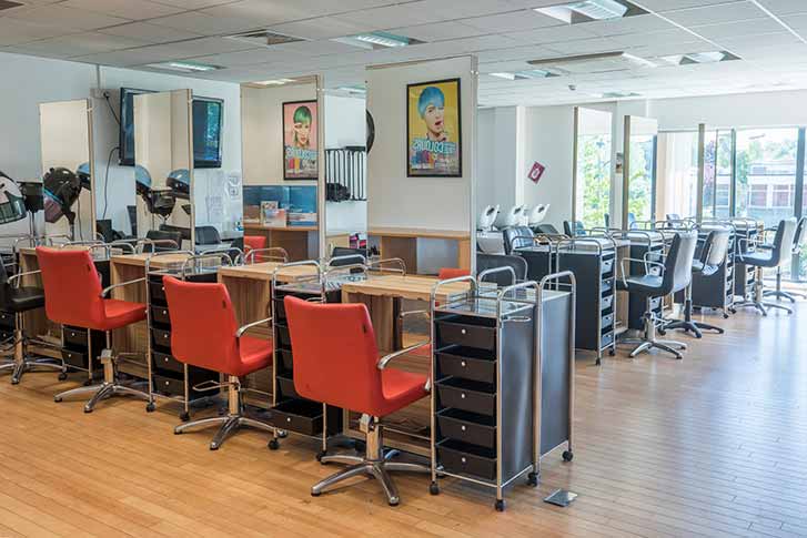Rows of hair dressing seats setup in the Radmmor Centre Training Salon interior